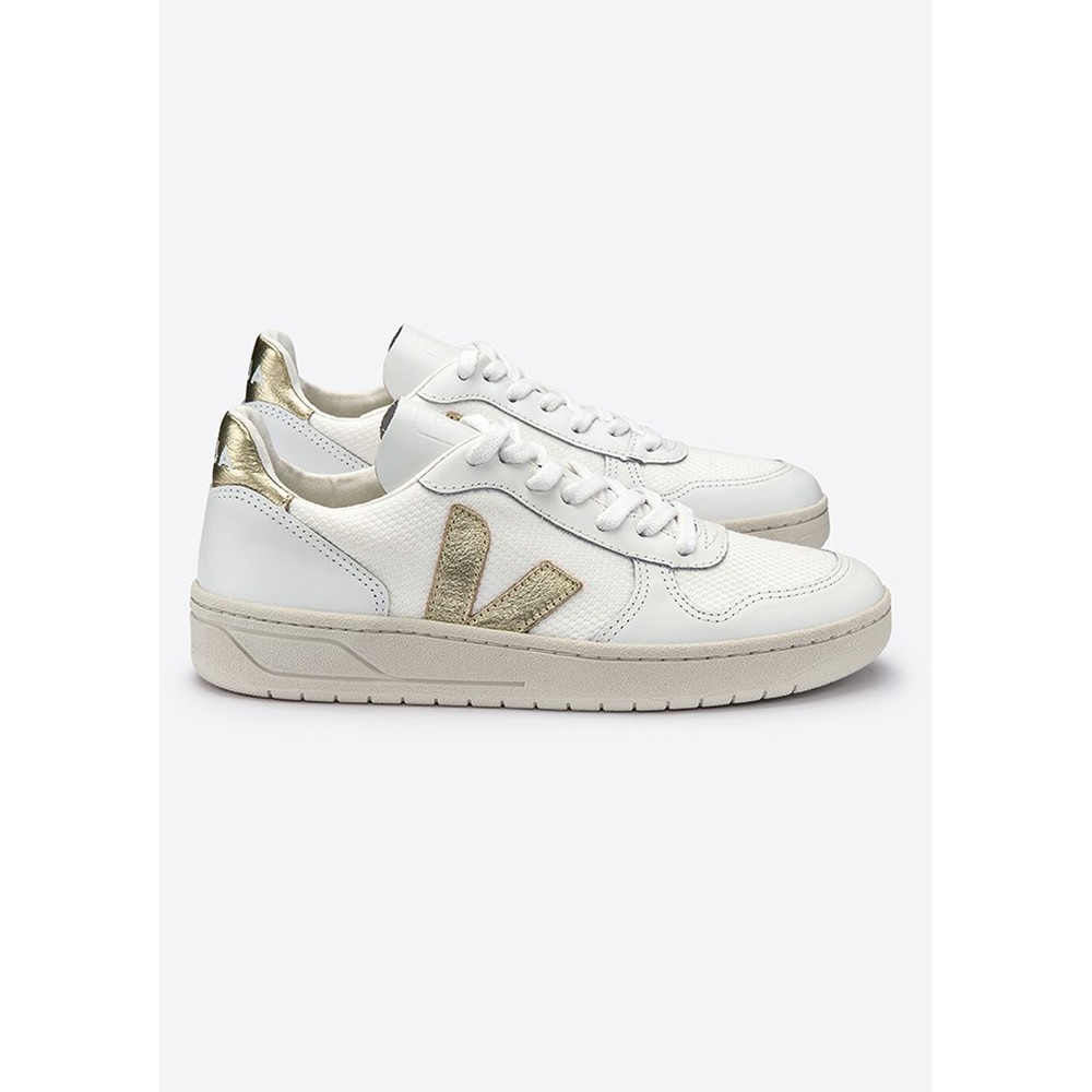 white and gold veja trainers